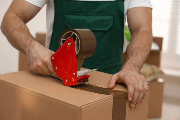 depositphotos_325020628-stock-photo-man-packing-box-with-adhesive.webp Brown Packaging Tape 48mm x 66m Unbranded - Image 2